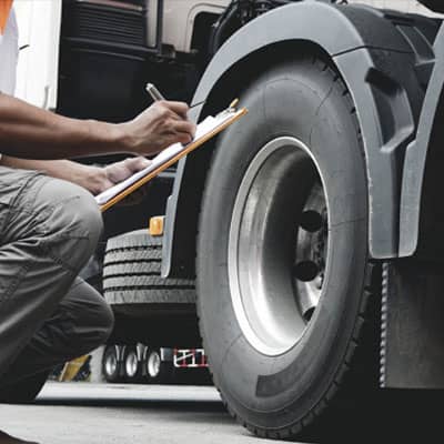 Auto Mechanic Checking Truck